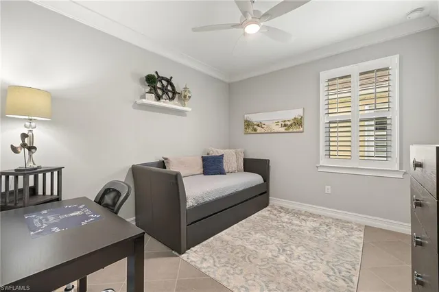 a bedroom with furniture and a window