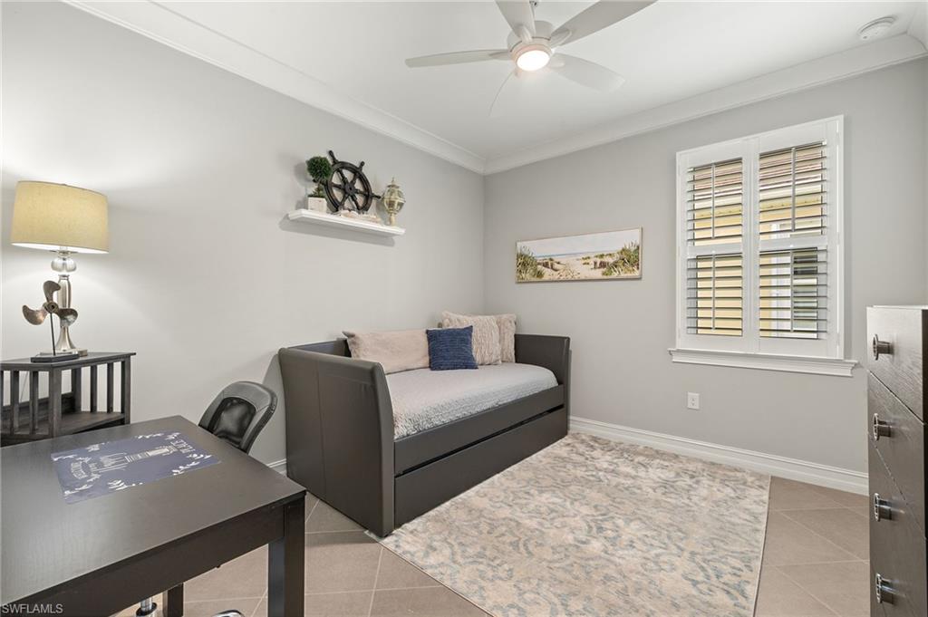 14671 Topsail Drive Naples, FL 34114 - Photo 16 of 36 a bedroom with furniture and a window