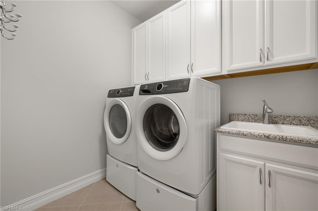 14671 Topsail Drive Naples, FL 34114 - Photo 21 of 36 a utility room with dryer and washer