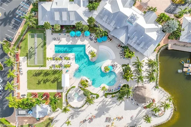 a aerial view of a house with a yard and a garden