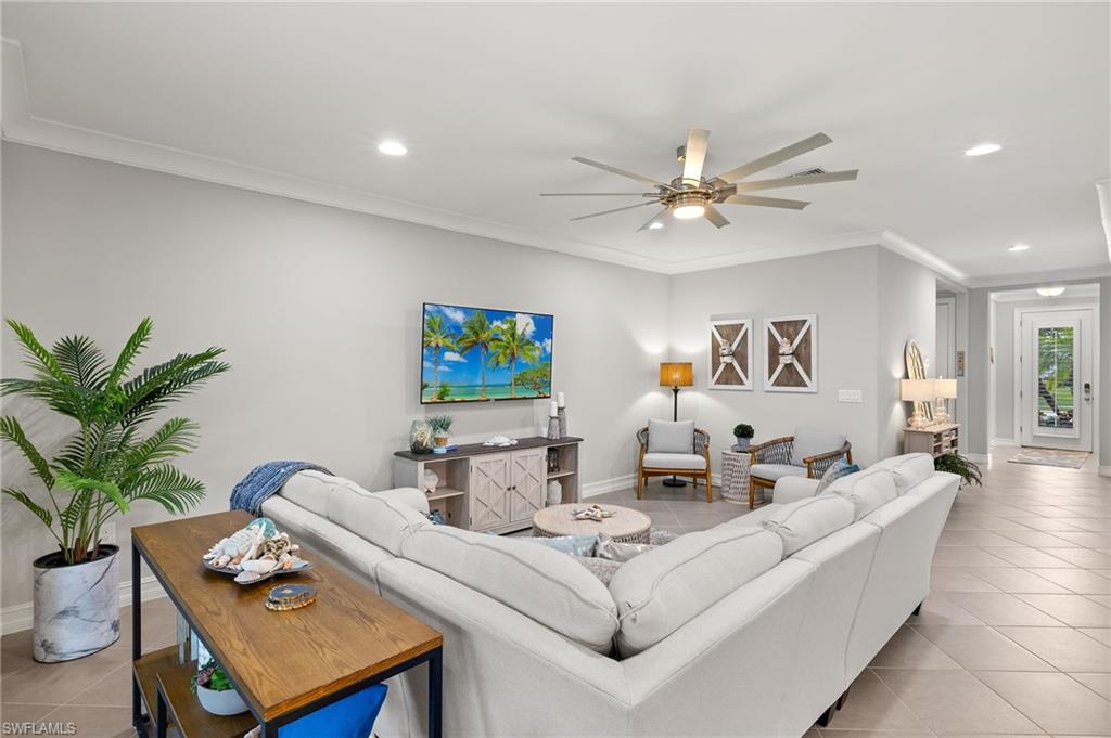 14671 Topsail Drive Naples, FL 34114 - Photo 9 of 36 a living room with furniture and a potted plant