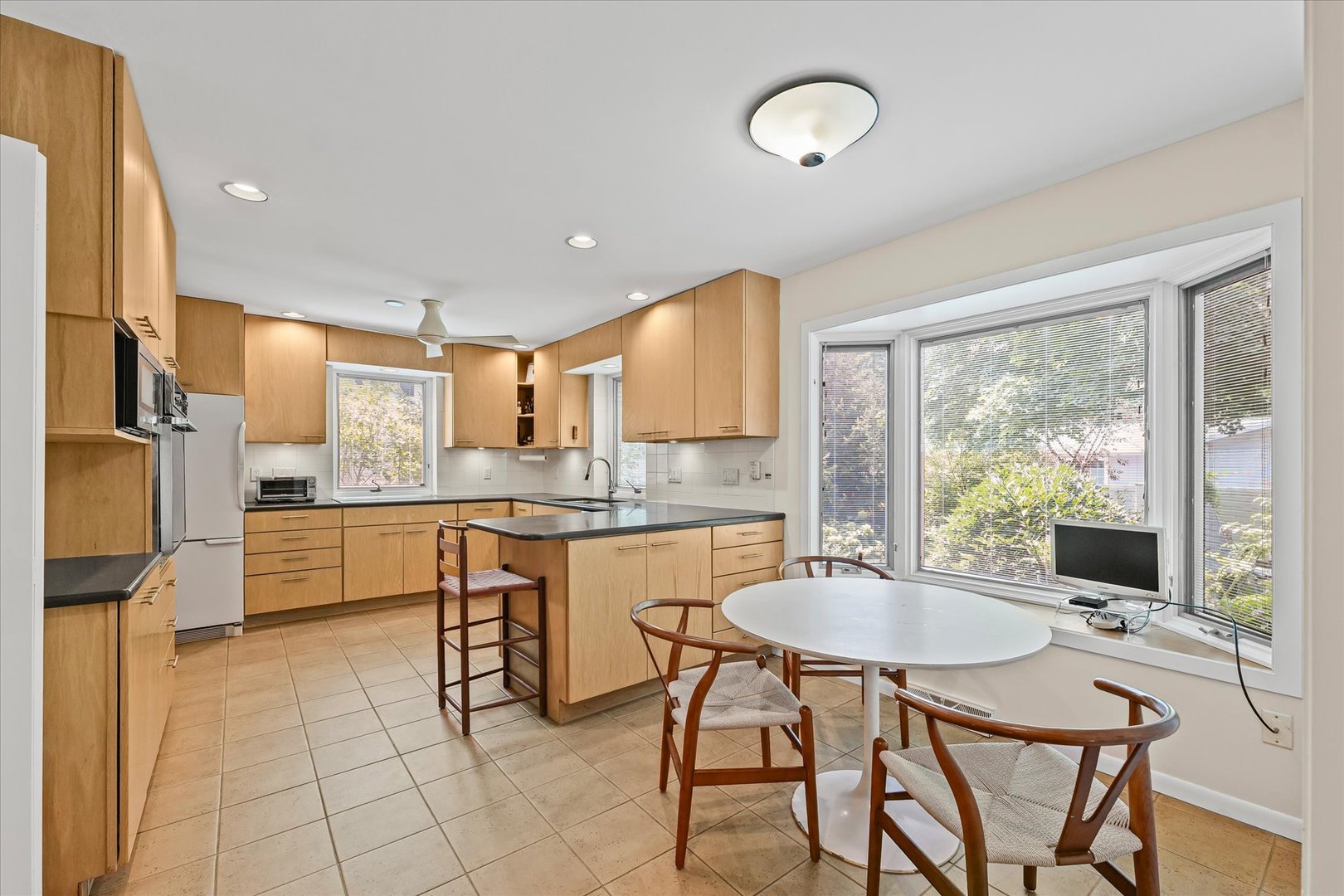 2119 Galen Drive Champaign, IL 61821 - Photo 13 of 39 a kitchen with a table chairs refrigerator and cabinets