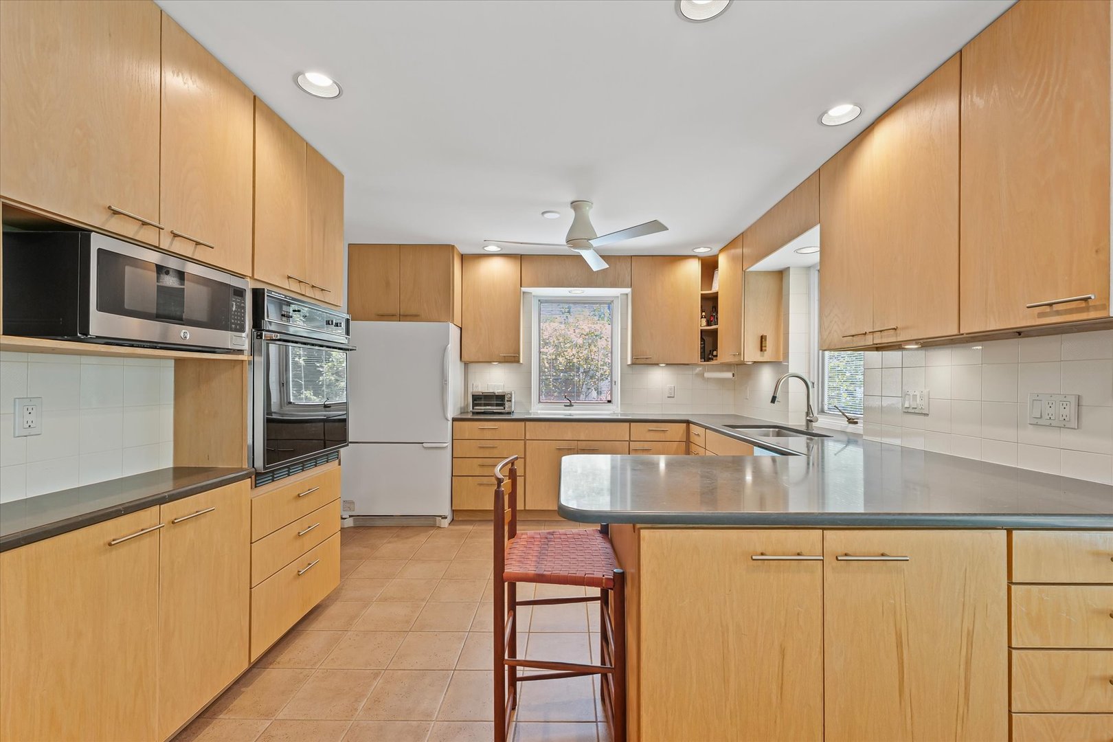 2119 Galen Drive Champaign, IL 61821 - Photo 14 of 39 a kitchen with stainless steel appliances granite countertop a stove a sink and a microwave