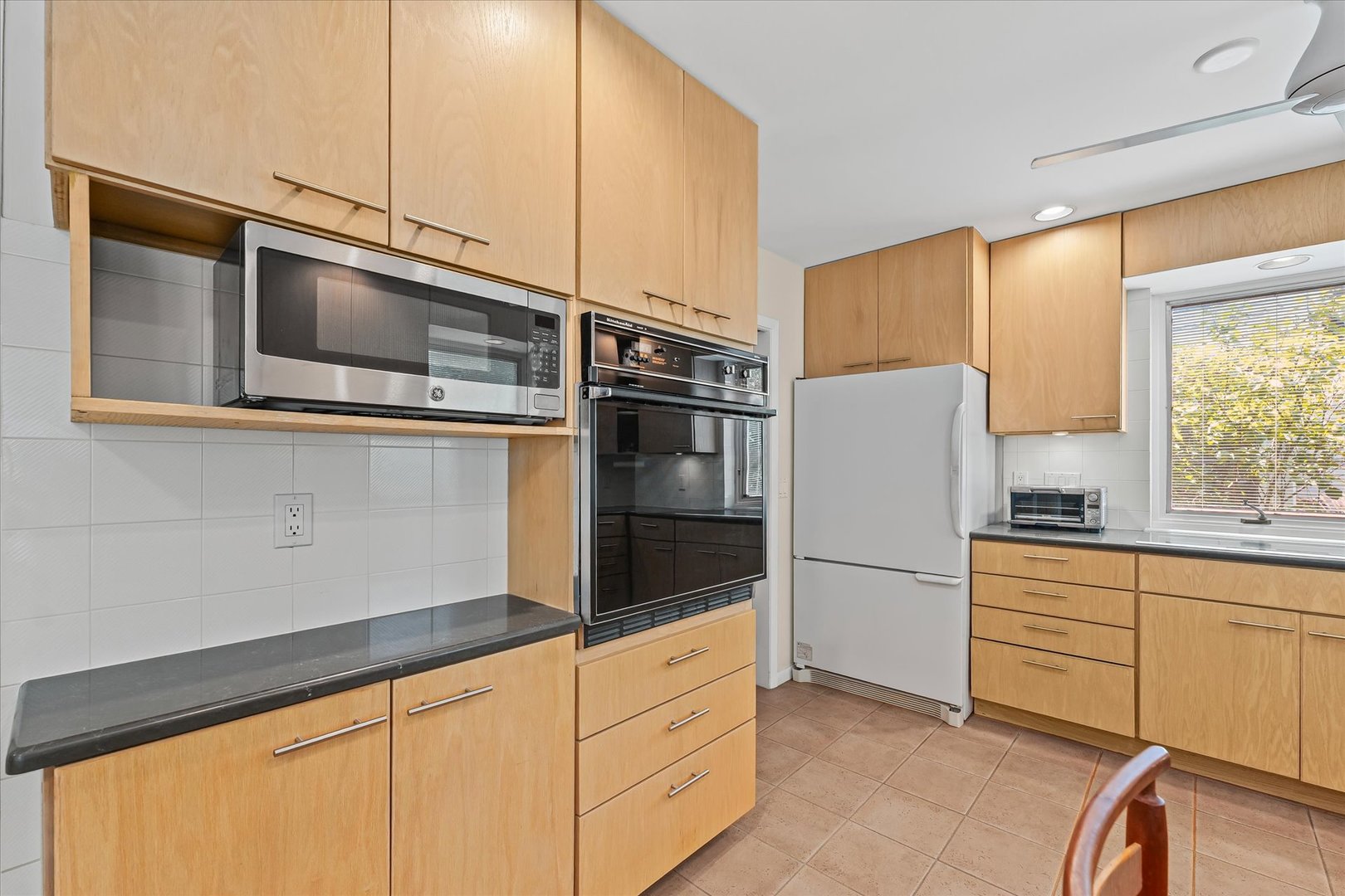 2119 Galen Drive Champaign, IL 61821 - Photo 18 of 39 a kitchen with stainless steel appliances a refrigerator sink and cabinets