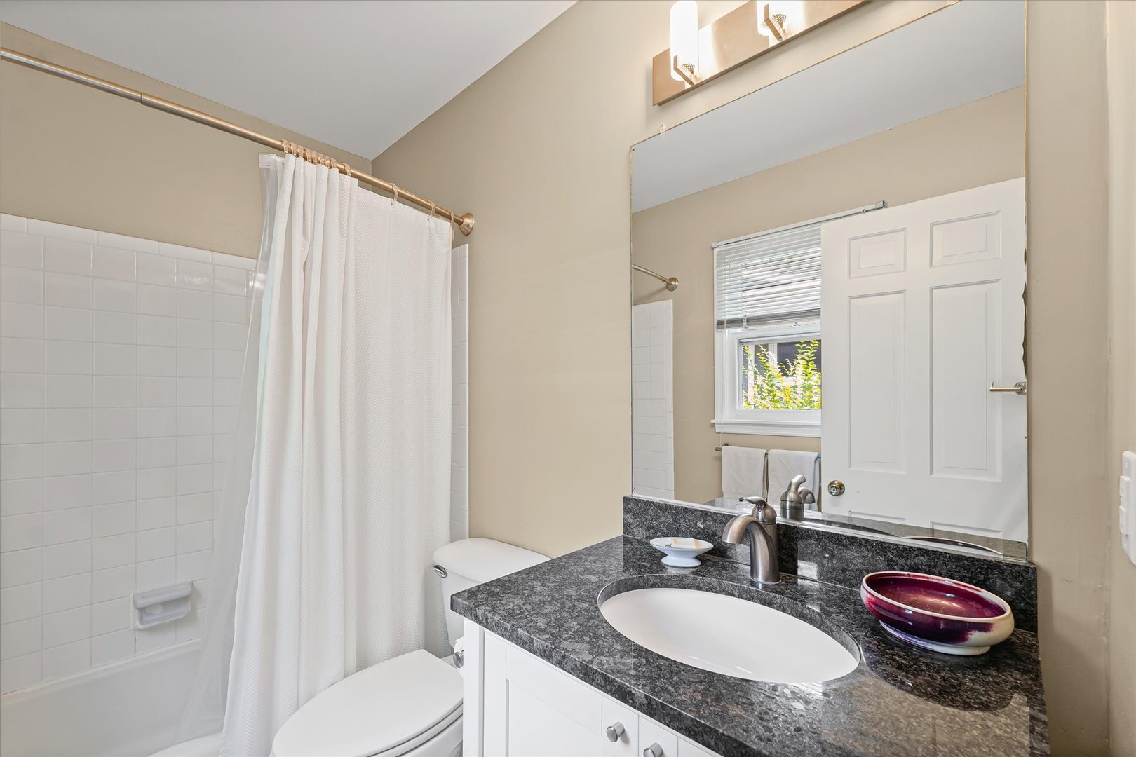 2119 Galen Drive Champaign, IL 61821 - Photo 25 of 39 a bathroom with a granite countertop sink and a mirror