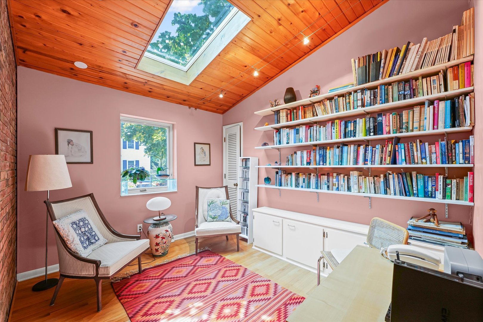 2119 Galen Drive Champaign, IL 61821 - Photo 31 of 39 a view of a workspace with furniture and a bookshelf