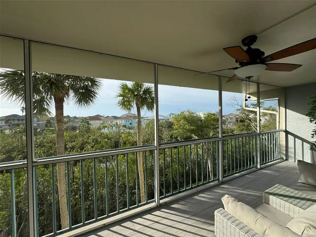 a view of a balcony with furniture