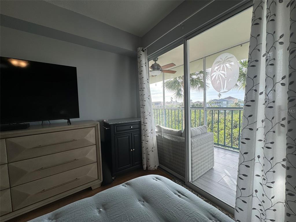 5537 Sea Forest Drive, Unit 208 New Port Richey, FL 34652 - Photo 19 of 26 a living room with furniture and a flat screen tv