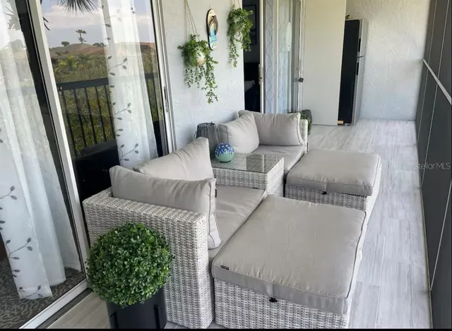 a living room with furniture and a window