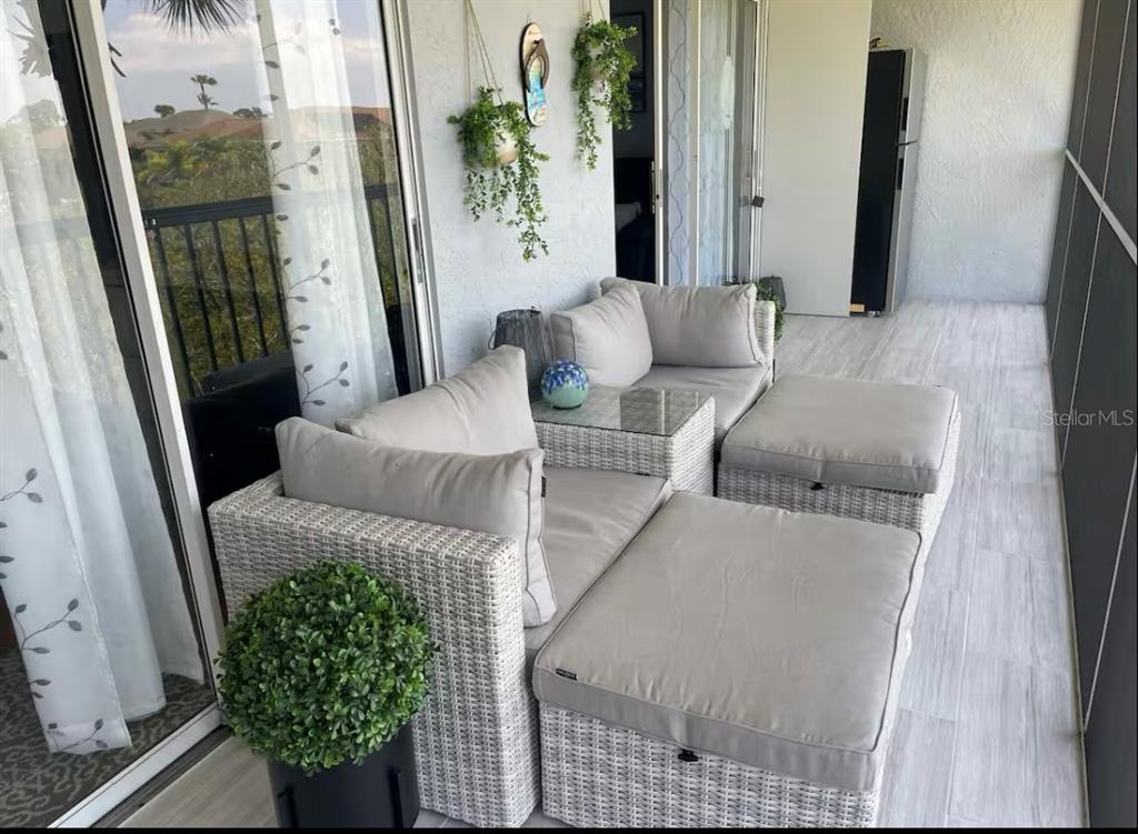 5537 Sea Forest Drive, Unit 208 New Port Richey, FL 34652 - Photo 20 of 26 a living room with furniture and a window