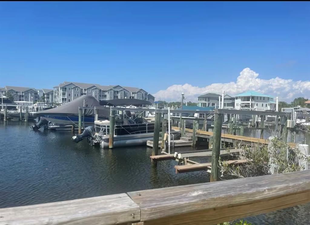 5537 Sea Forest Drive, Unit 208 New Port Richey, FL 34652 - Photo 2 of 26 a view of a lake with a mountain view