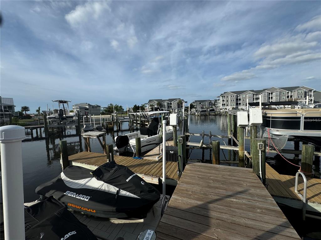 5537 Sea Forest Drive, Unit 208 New Port Richey, FL 34652 - Photo 21 of 26 a view of a chairs and table on the terrace