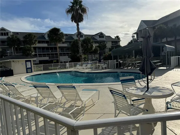 a view of a swimming pool with a patio