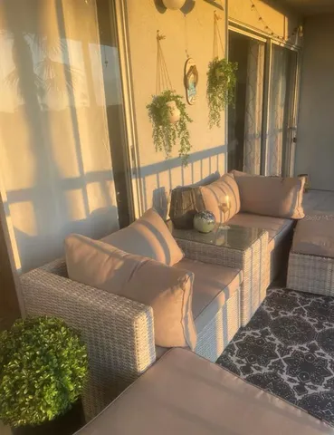 a living room with furniture and a window