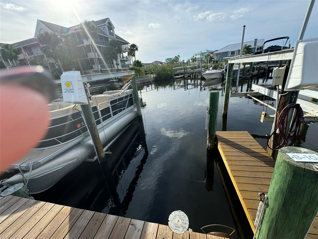 5537 Sea Forest Drive, Unit 208 New Port Richey, FL 34652 - Photo 25 of 26 a view of a balcony with two chairs