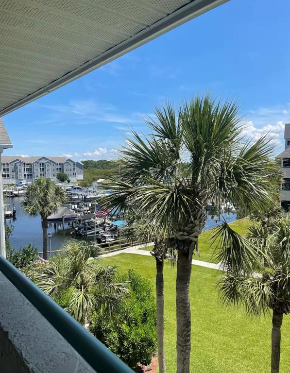 5537 Sea Forest Drive, Unit 208 New Port Richey, FL 34652 - Photo 26 of 26 a view of swimming pool from a balcony