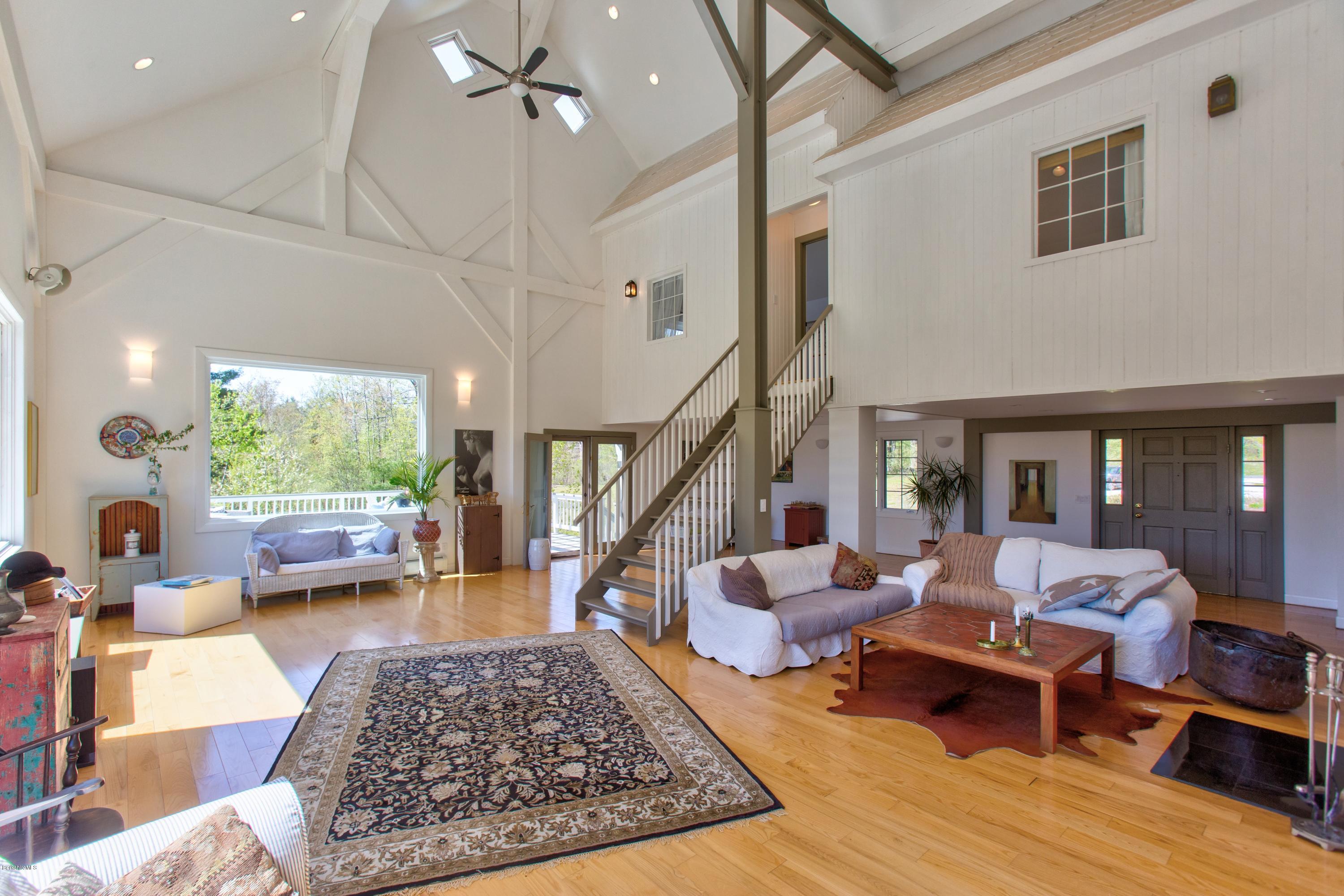 49 New Hartford Road Sandisfield, MA 01255 - Photo 13 of 41 a living room with furniture large window and a table