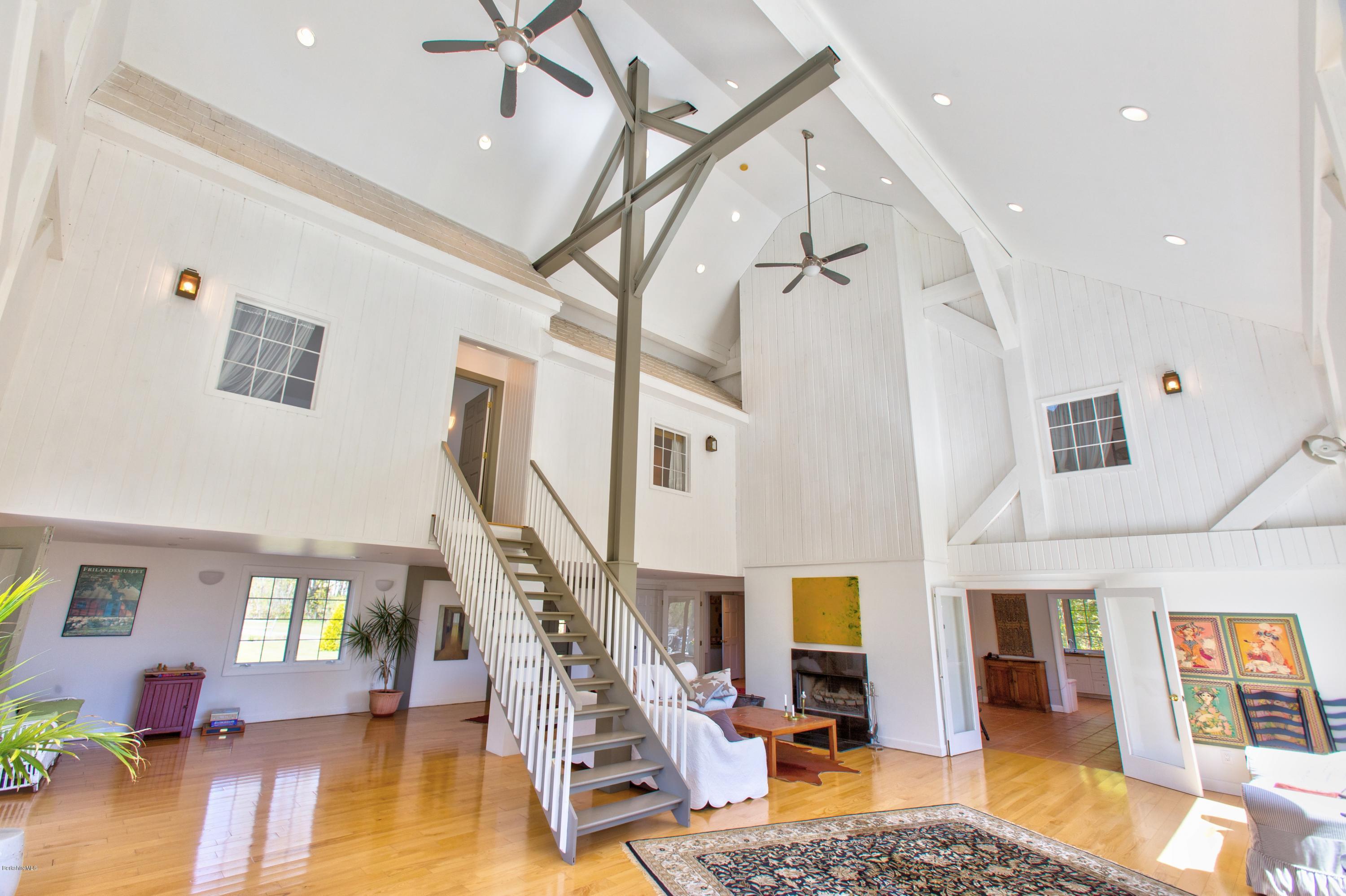 49 New Hartford Road Sandisfield, MA 01255 - Photo 14 of 41 a living room with lots of furniture and a rug