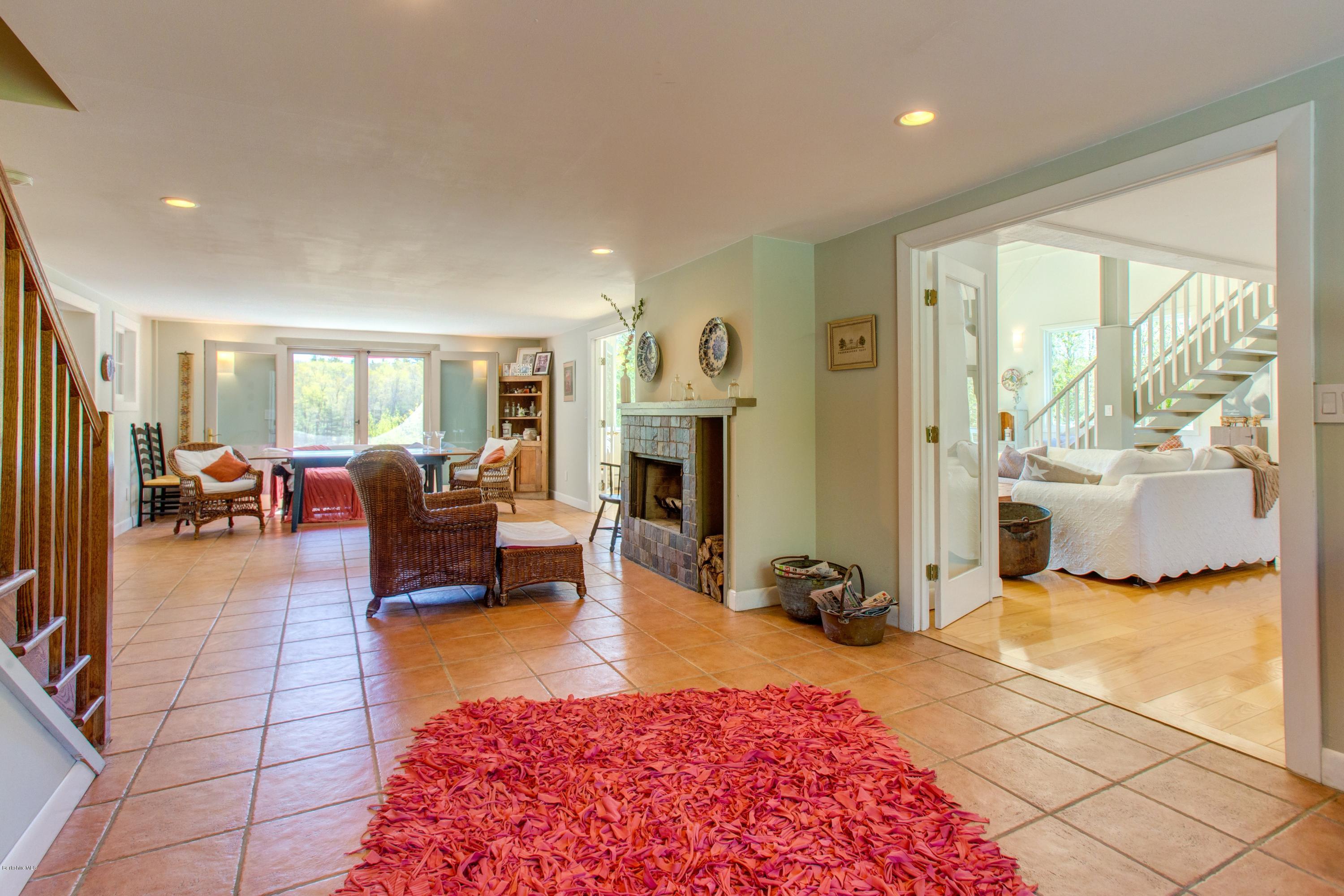 49 New Hartford Road Sandisfield, MA 01255 - Photo 18 of 41 a living room with furniture large window and a table
