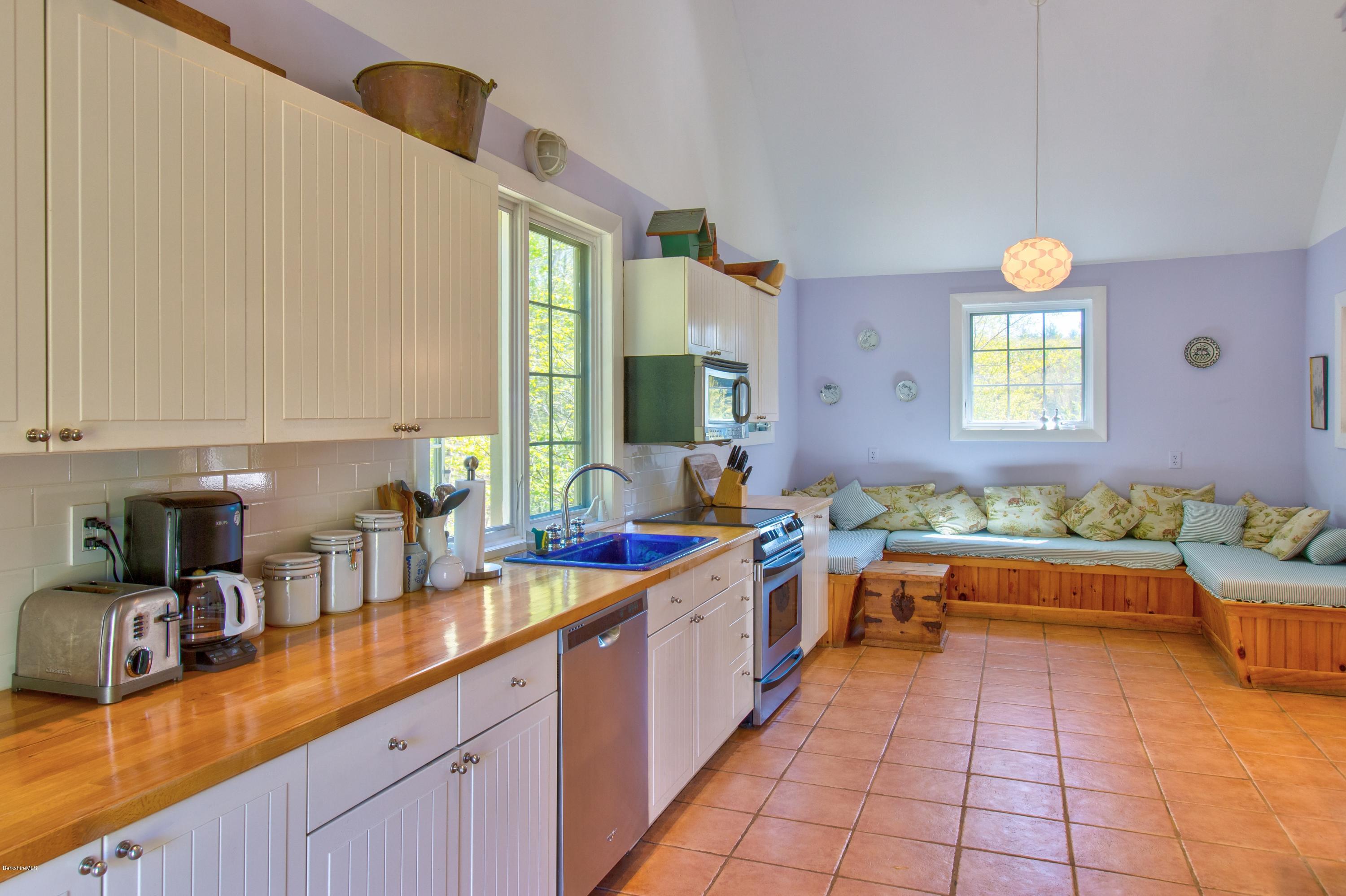 49 New Hartford Road Sandisfield, MA 01255 - Photo 20 of 41 a large white kitchen with a large window