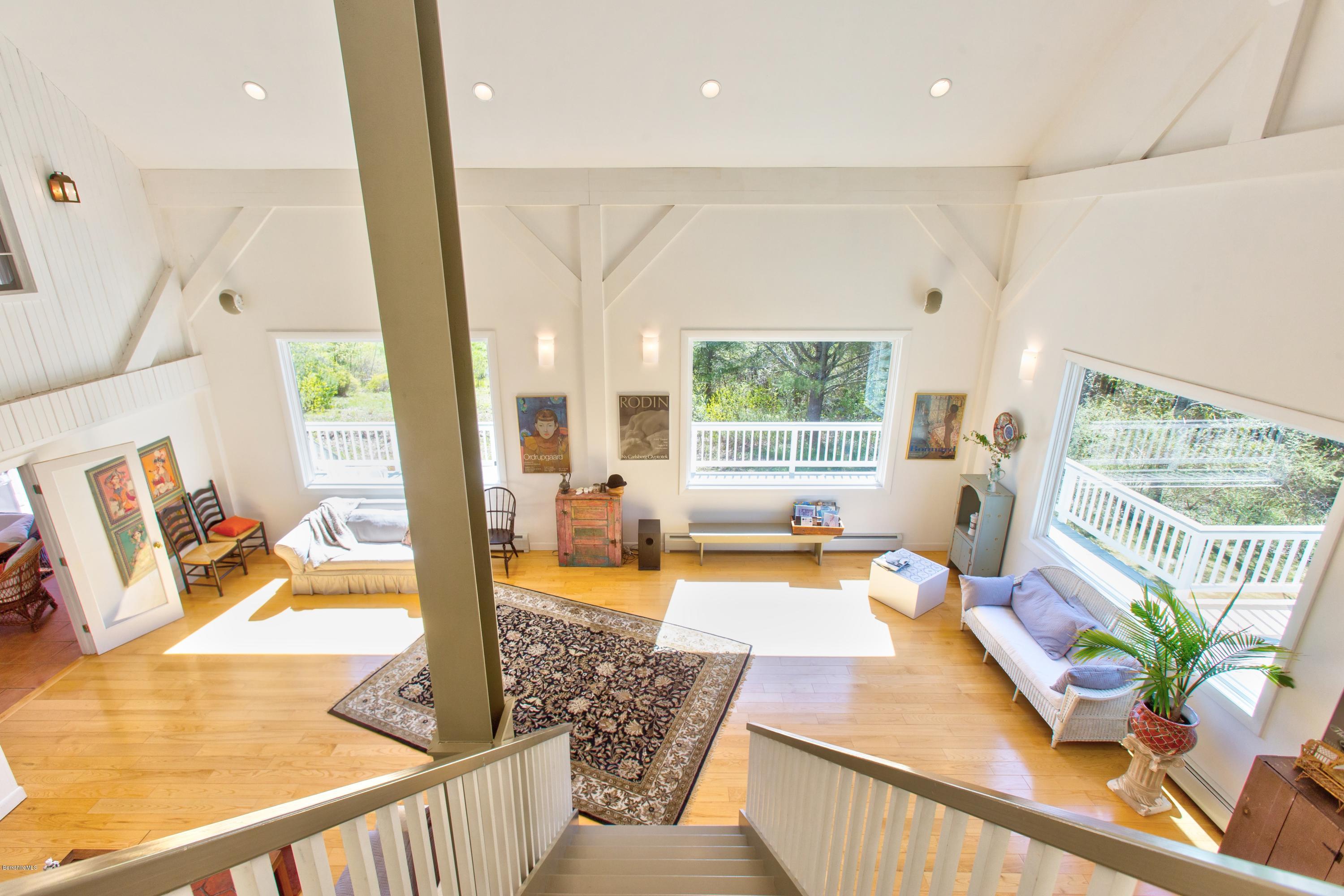 49 New Hartford Road Sandisfield, MA 01255 - Photo 26 of 41 a living room with furniture and a large window