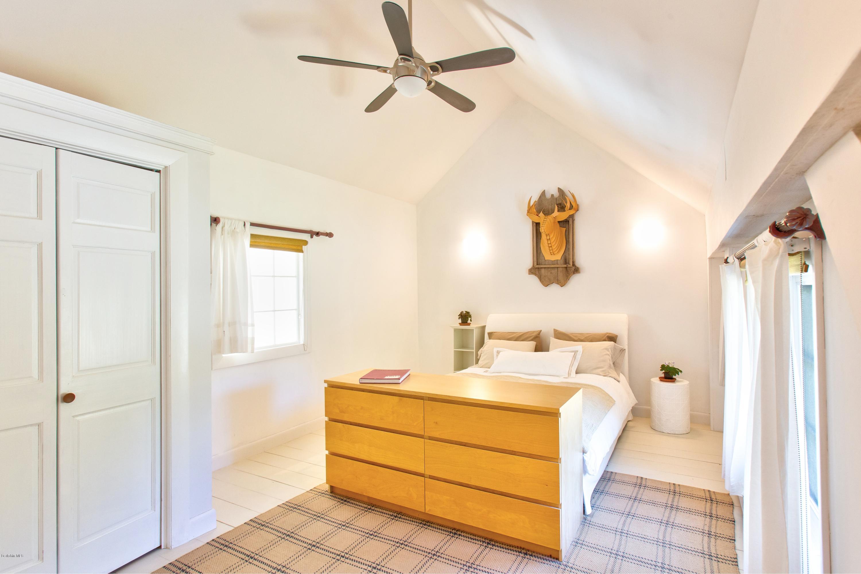 49 New Hartford Road Sandisfield, MA 01255 - Photo 27 of 41 a bathroom with a sink mirror and a shower