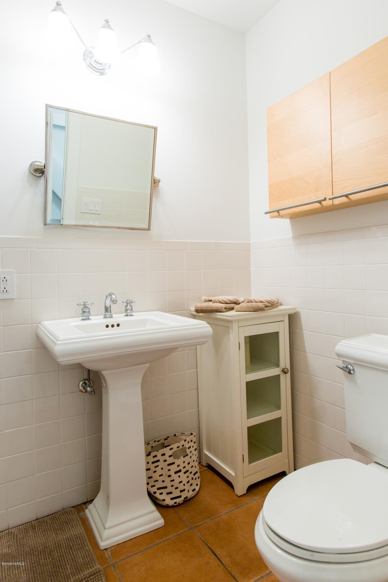 49 New Hartford Road Sandisfield, MA 01255 - Photo 28 of 41 a bathroom with a sink toilet and mirror