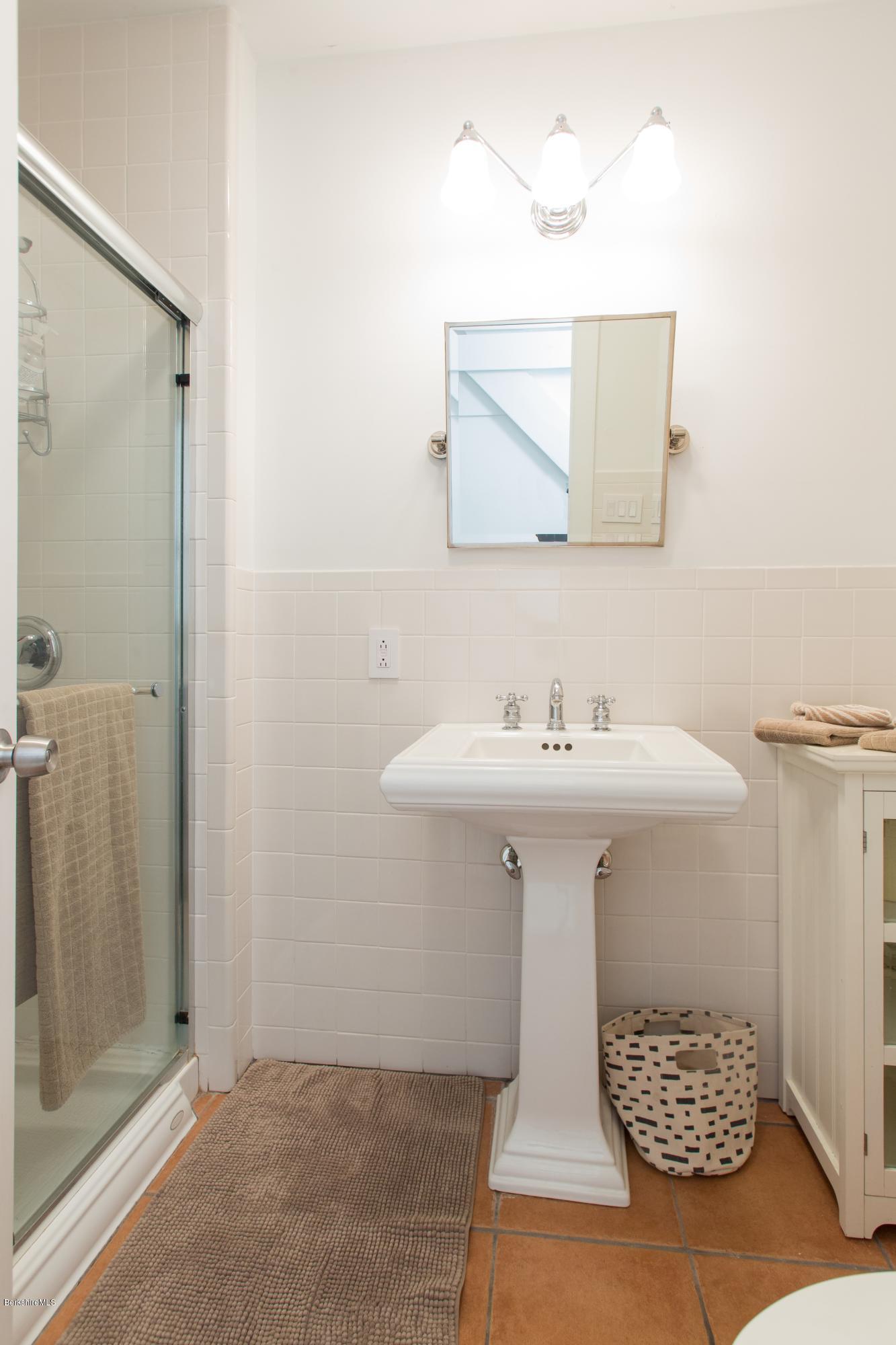 49 New Hartford Road Sandisfield, MA 01255 - Photo 29 of 41 a bathroom with a sink and mirror