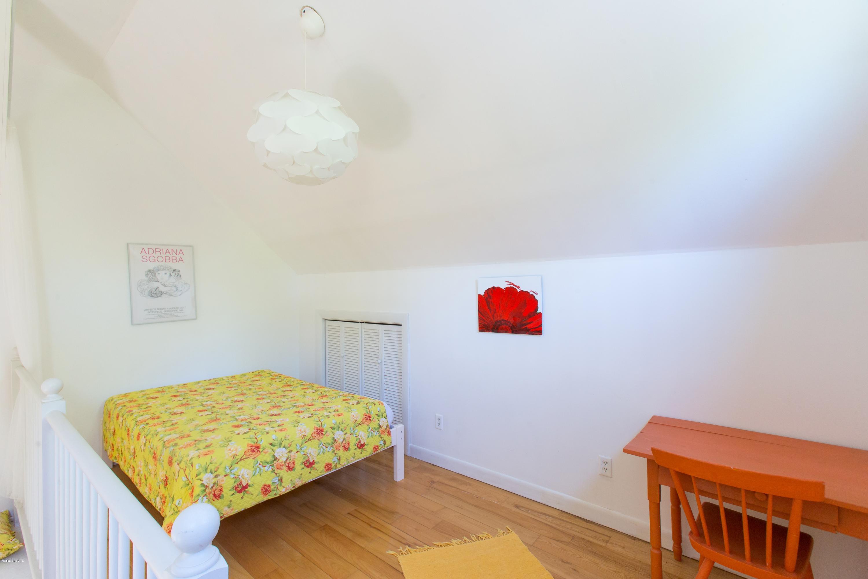 49 New Hartford Road Sandisfield, MA 01255 - Photo 33 of 41 a bedroom with a bed and a dresser