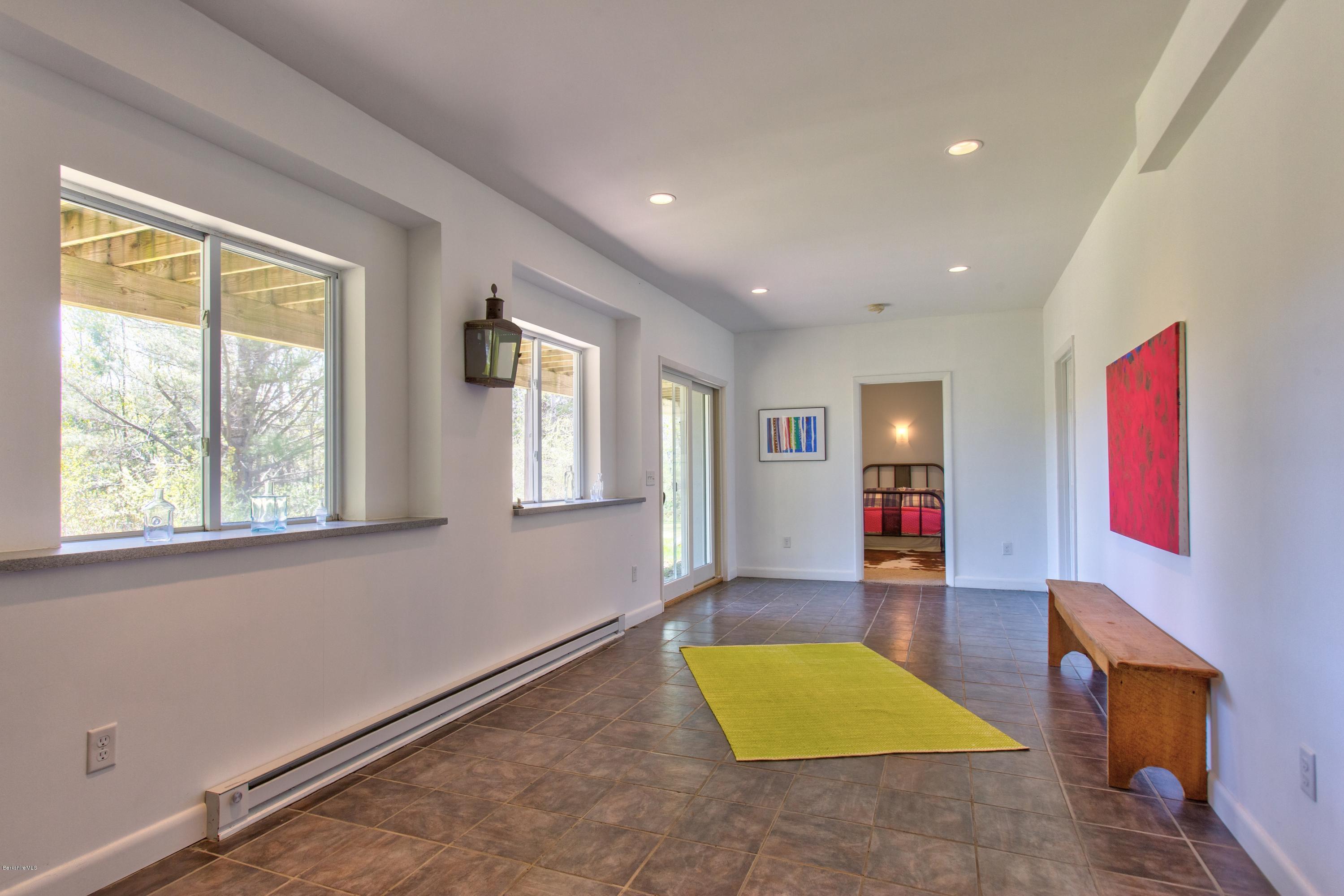 49 New Hartford Road Sandisfield, MA 01255 - Photo 36 of 41 a living room with furniture and a window