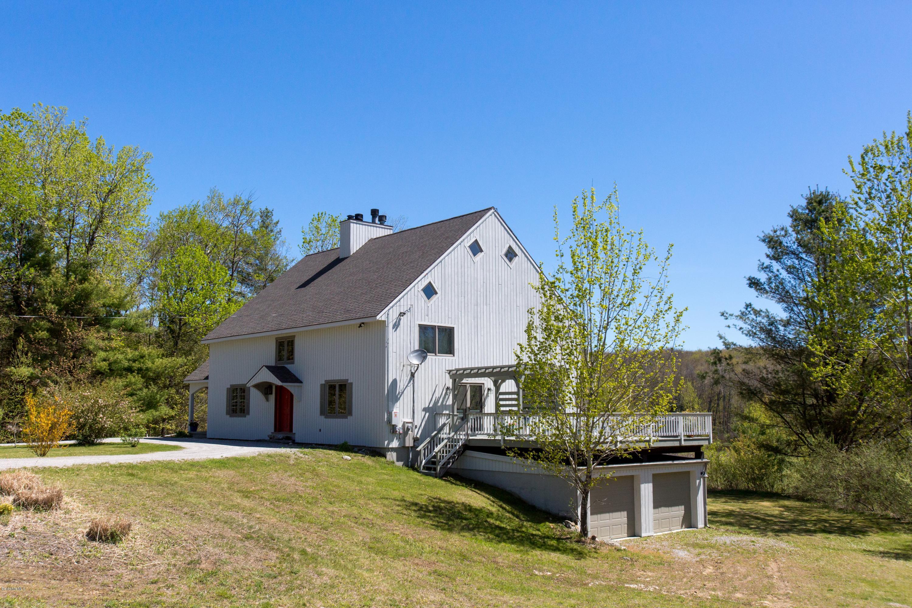 49 New Hartford Road Sandisfield, MA 01255 - Photo 5 of 41 a front view of a house with garden