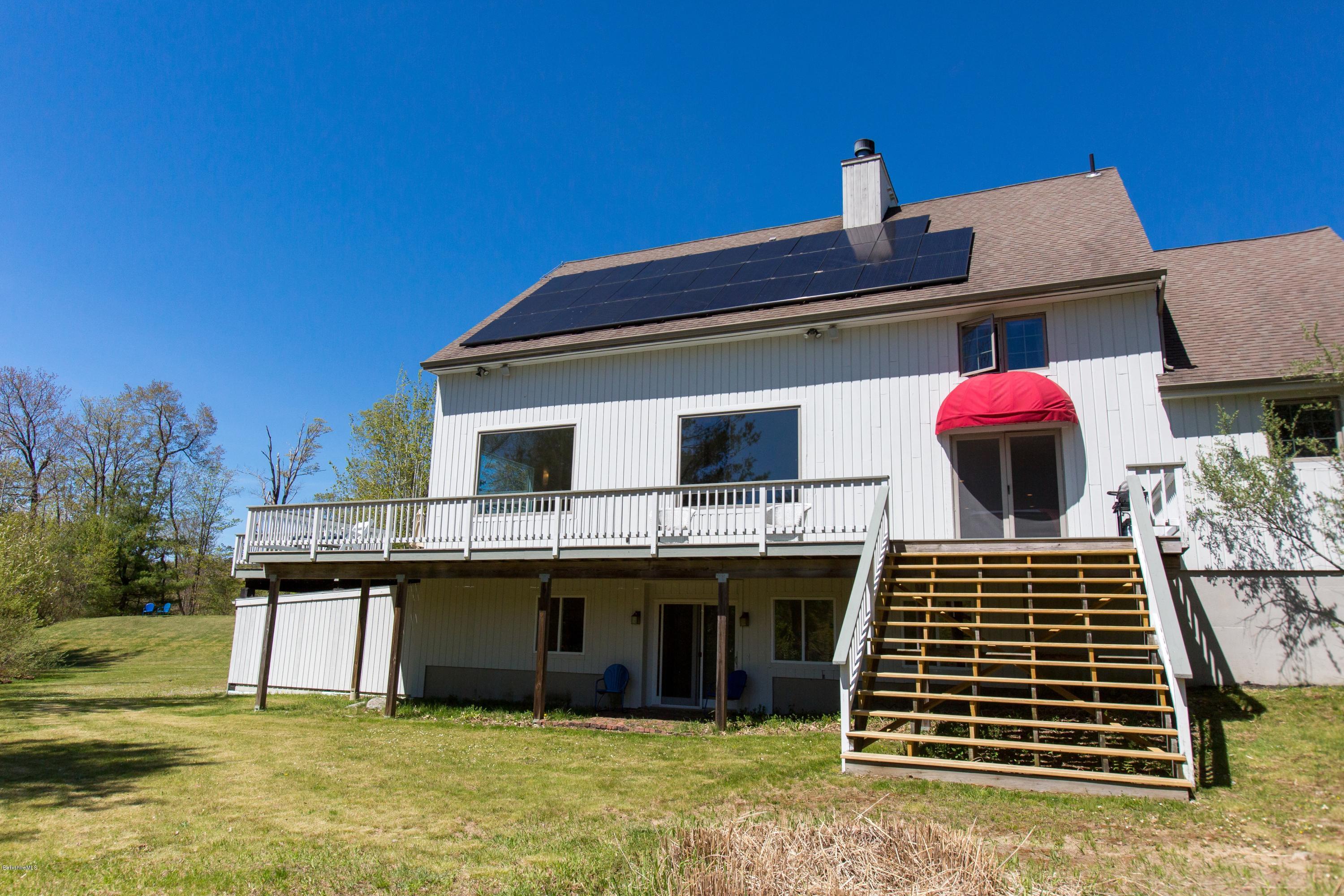 49 New Hartford Road Sandisfield, MA 01255 - Photo 7 of 41 a front view of a house with a garden