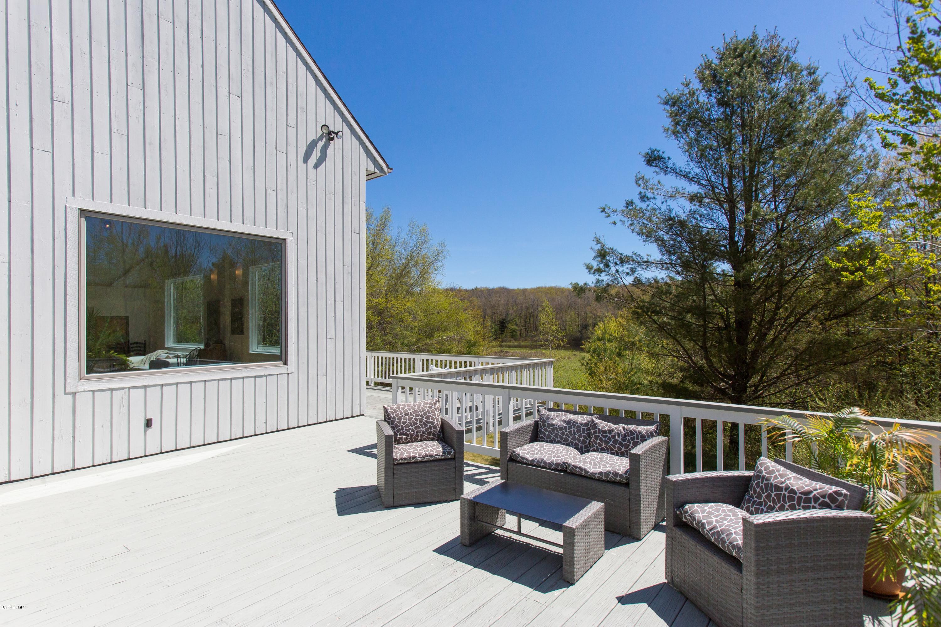 49 New Hartford Road Sandisfield, MA 01255 - Photo 9 of 41 a outdoor living space with furniture and city view
