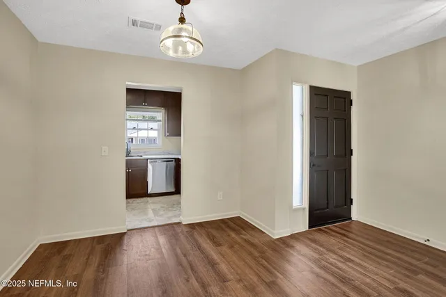 a view of an empty room with a window
