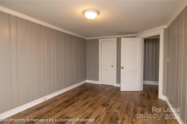 a view of hallway with wooden floor