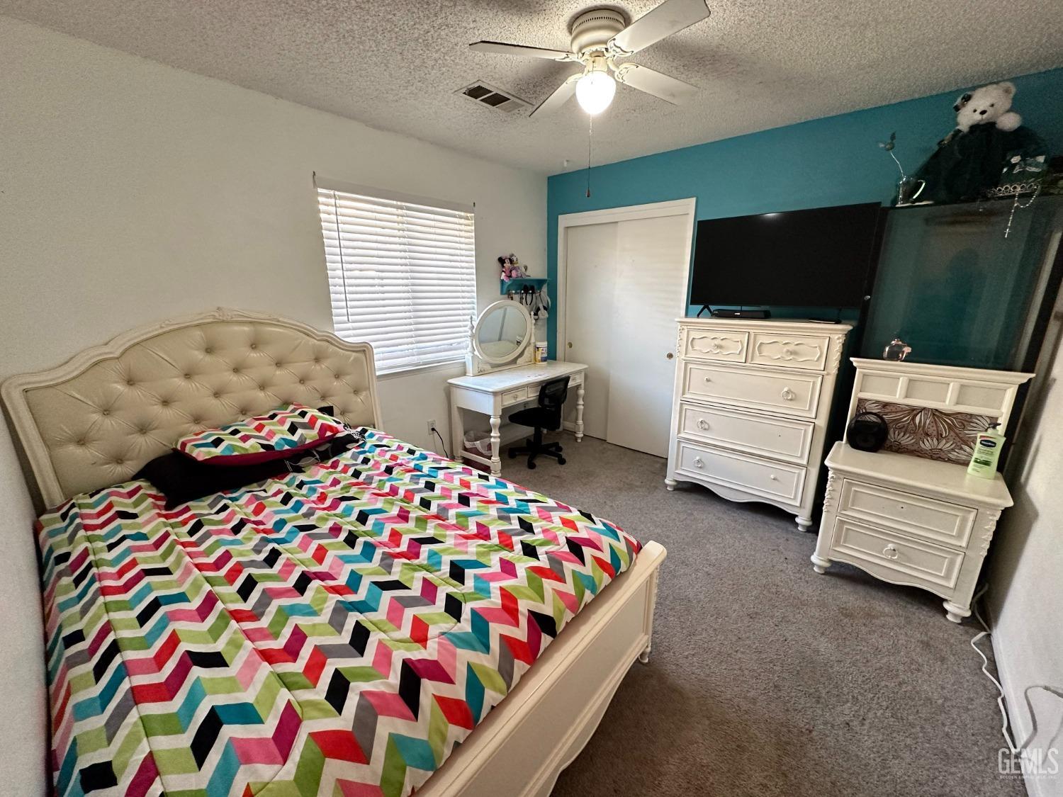 Undisclosed Address Shafter, CA 93263 - Photo 14 of 14 a bedroom with a bed and flat screen tv