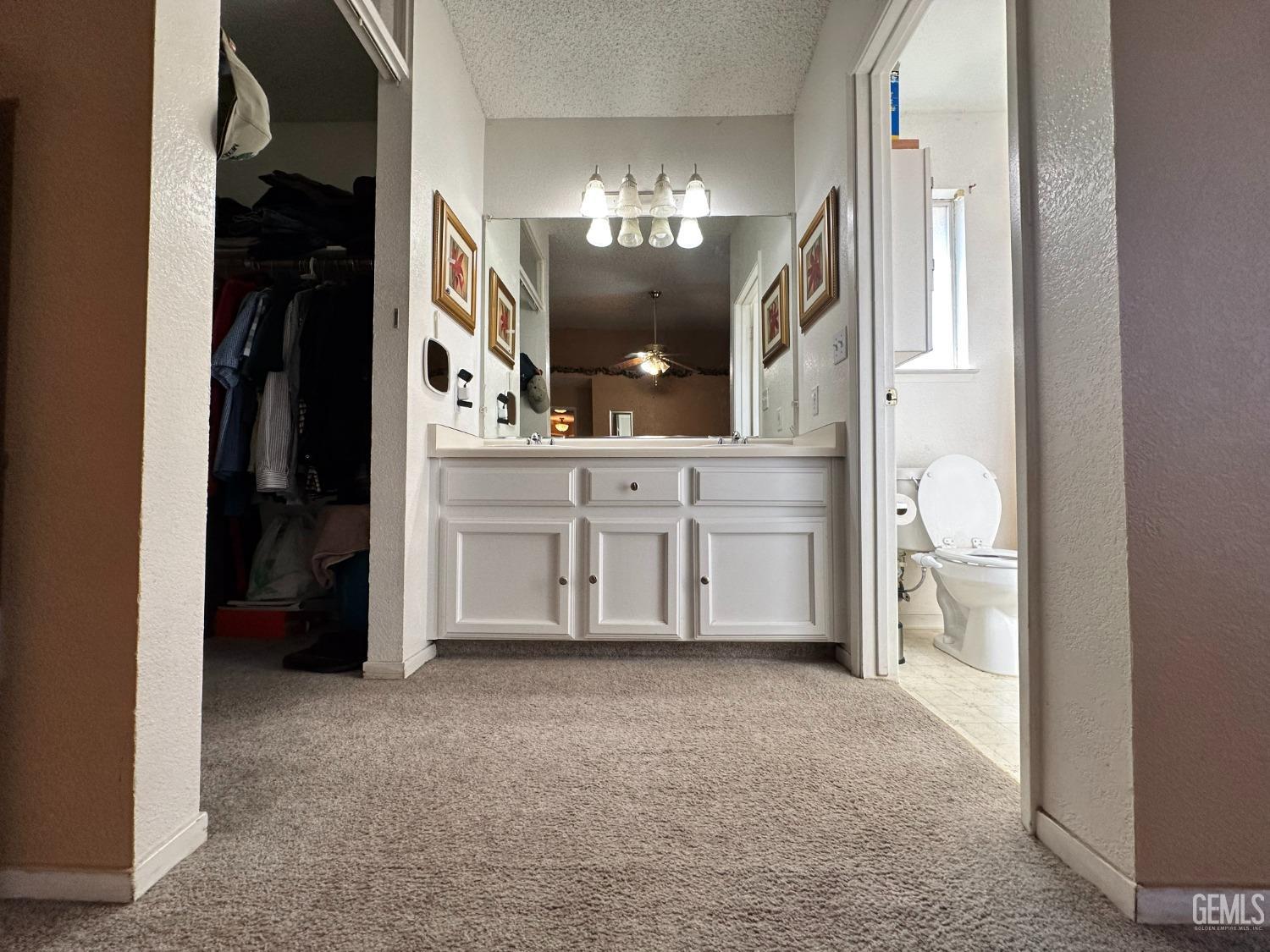 Undisclosed Address Shafter, CA 93263 - Photo 4 of 14 a view of a kitchen with a refrigerator and mirror
