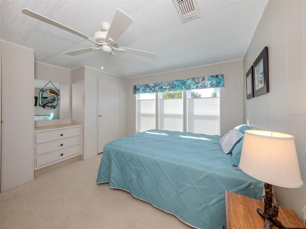 130 Lazy River Road North Port, FL 34287 - Photo 18 of 50 a bedroom with a bed and window