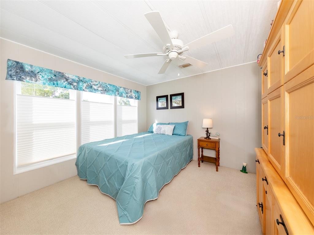 130 Lazy River Road North Port, FL 34287 - Photo 19 of 50 a spacious bedroom with a bed and a window