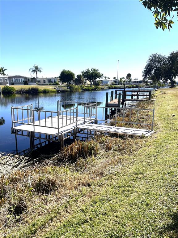 130 Lazy River Road North Port, FL 34287 - Photo 27 of 50 a small pool with lawn chairs
