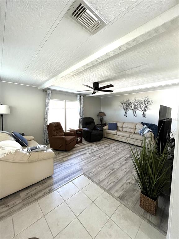 130 Lazy River Road North Port, FL 34287 - Photo 4 of 50 a living room with furniture flowerpot and a potted plant