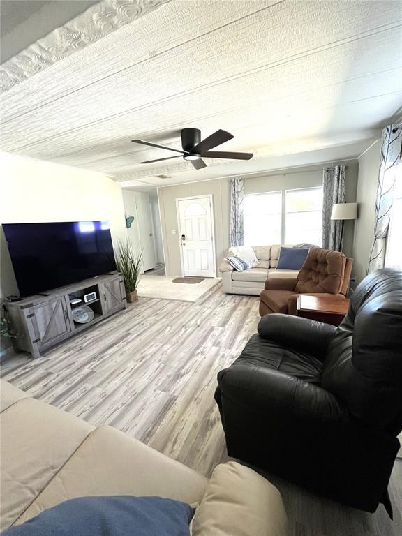 130 Lazy River Road North Port, FL 34287 - Photo 5 of 50 a living room with furniture and a flat screen tv