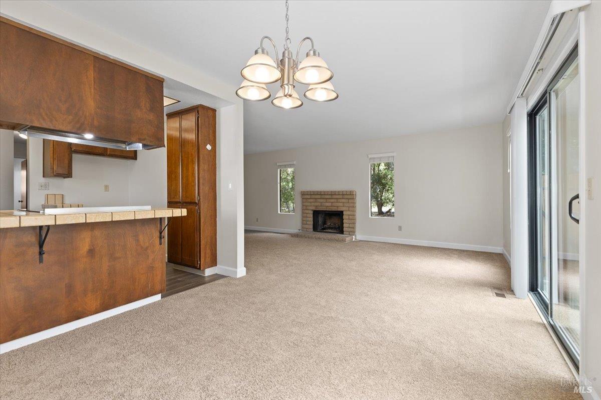 920 Shady Oak Drive Santa Rosa, CA 95404 - Photo 12 of 37 a view of a kitchen with a sink cabinets and a fireplace