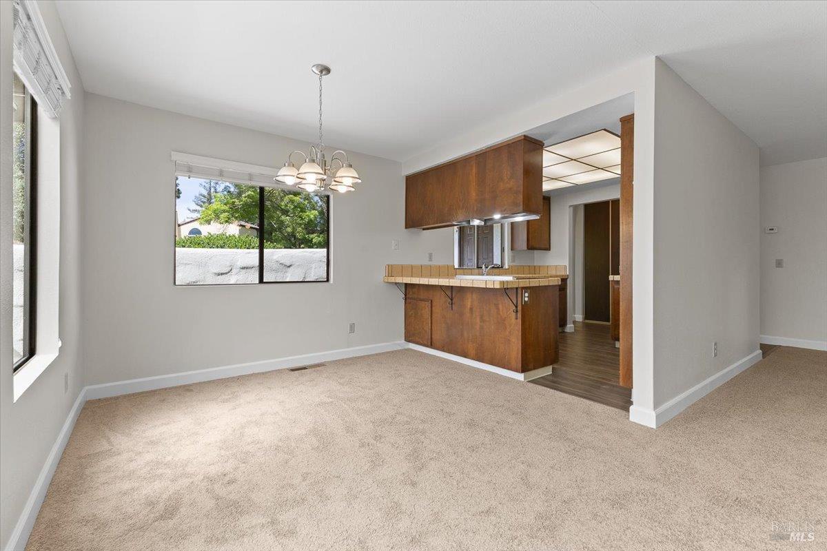 920 Shady Oak Drive Santa Rosa, CA 95404 - Photo 13 of 37 an empty room with windows and refrigerator
