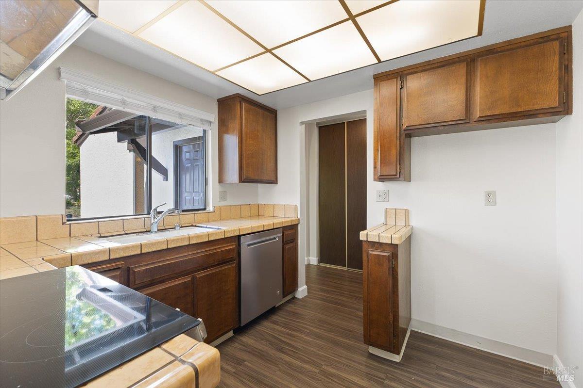 920 Shady Oak Drive Santa Rosa, CA 95404 - Photo 14 of 37 a room with stainless steel appliances granite countertop a sink and a wooden cabinets