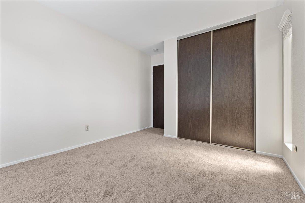 920 Shady Oak Drive Santa Rosa, CA 95404 - Photo 17 of 37 an empty room with closet area