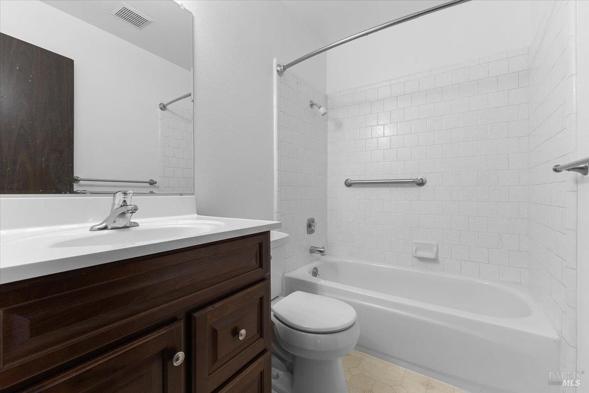920 Shady Oak Drive Santa Rosa, CA 95404 - Photo 18 of 37 a bathroom with a sink a toilet and shower