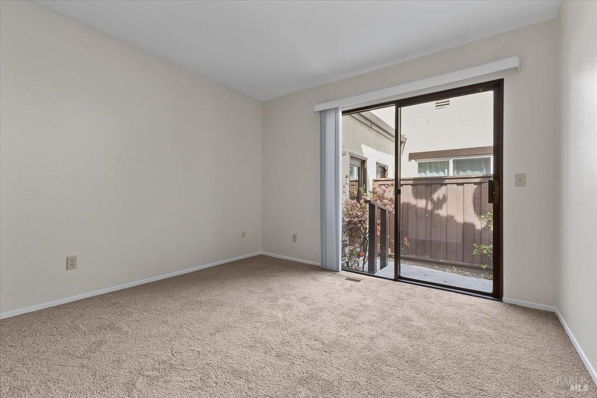920 Shady Oak Drive Santa Rosa, CA 95404 - Photo 19 of 37 a view of an empty room with sliding door