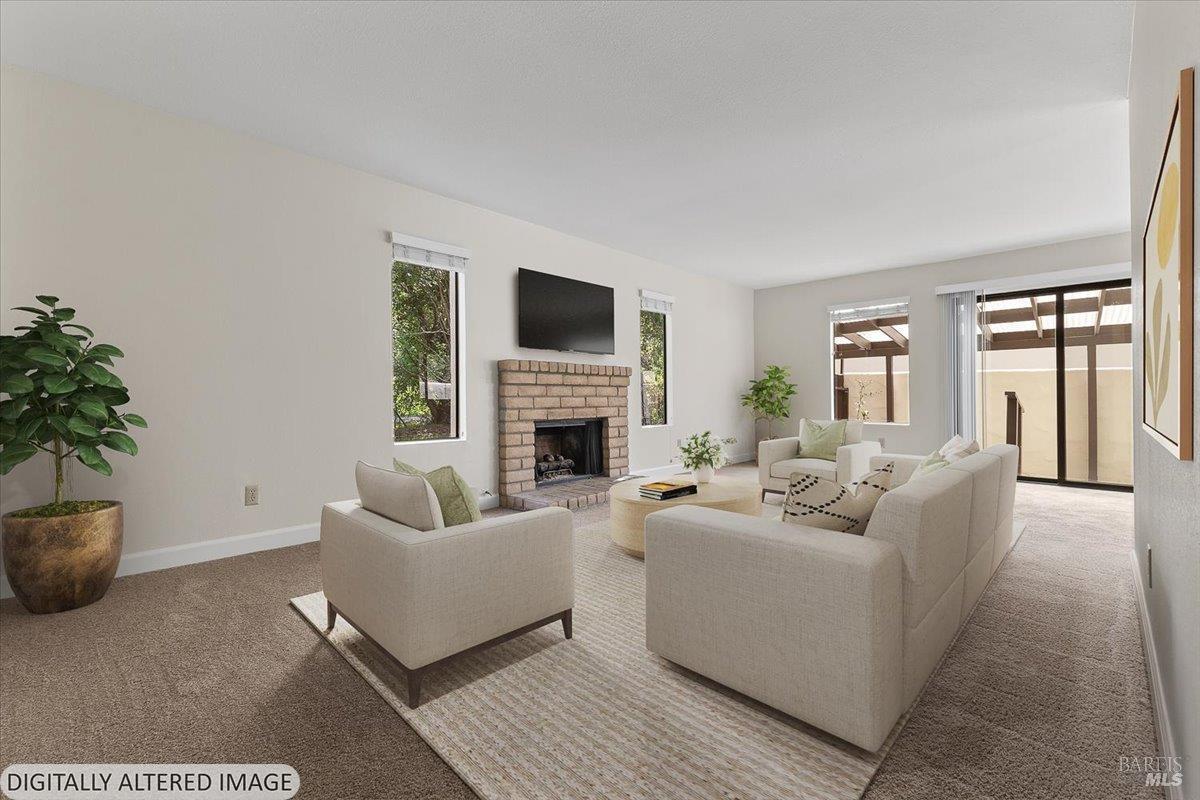 920 Shady Oak Drive Santa Rosa, CA 95404 - Photo 5 of 37 a living room with furniture a fireplace and a potted plant