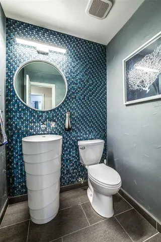 a bathroom with a toilet and a sink